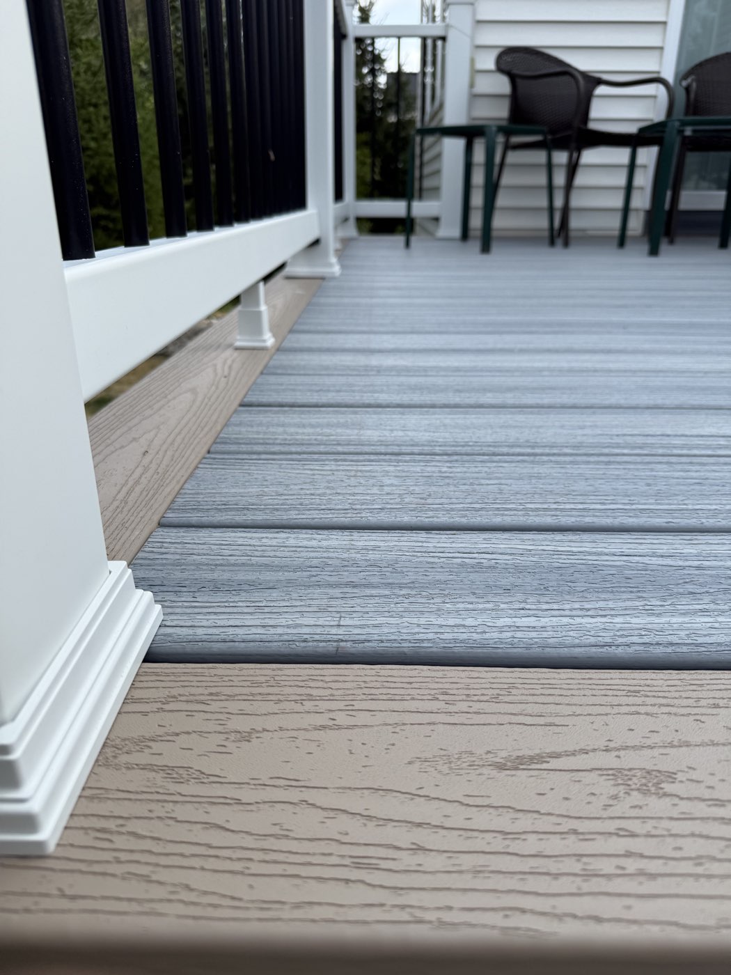 Two-tone composite deck boards with white railing