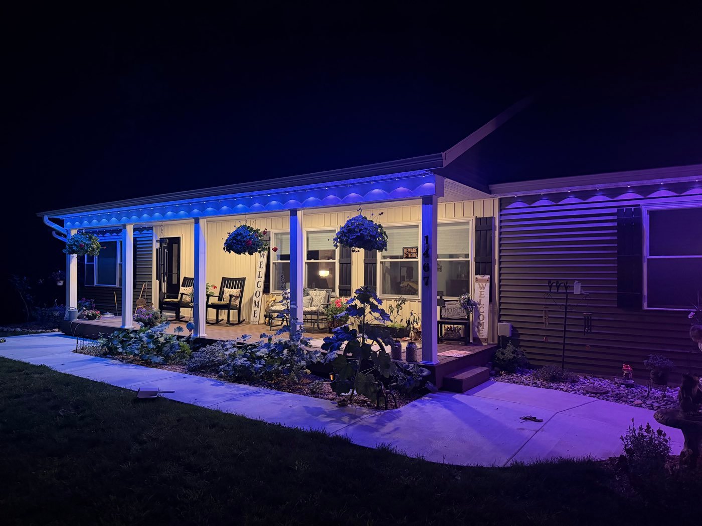 Front porch lit with blue permanent soffit lighting