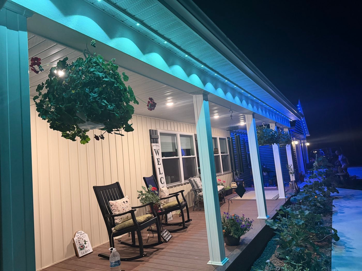 Covered porch glowing with blue soffit lights