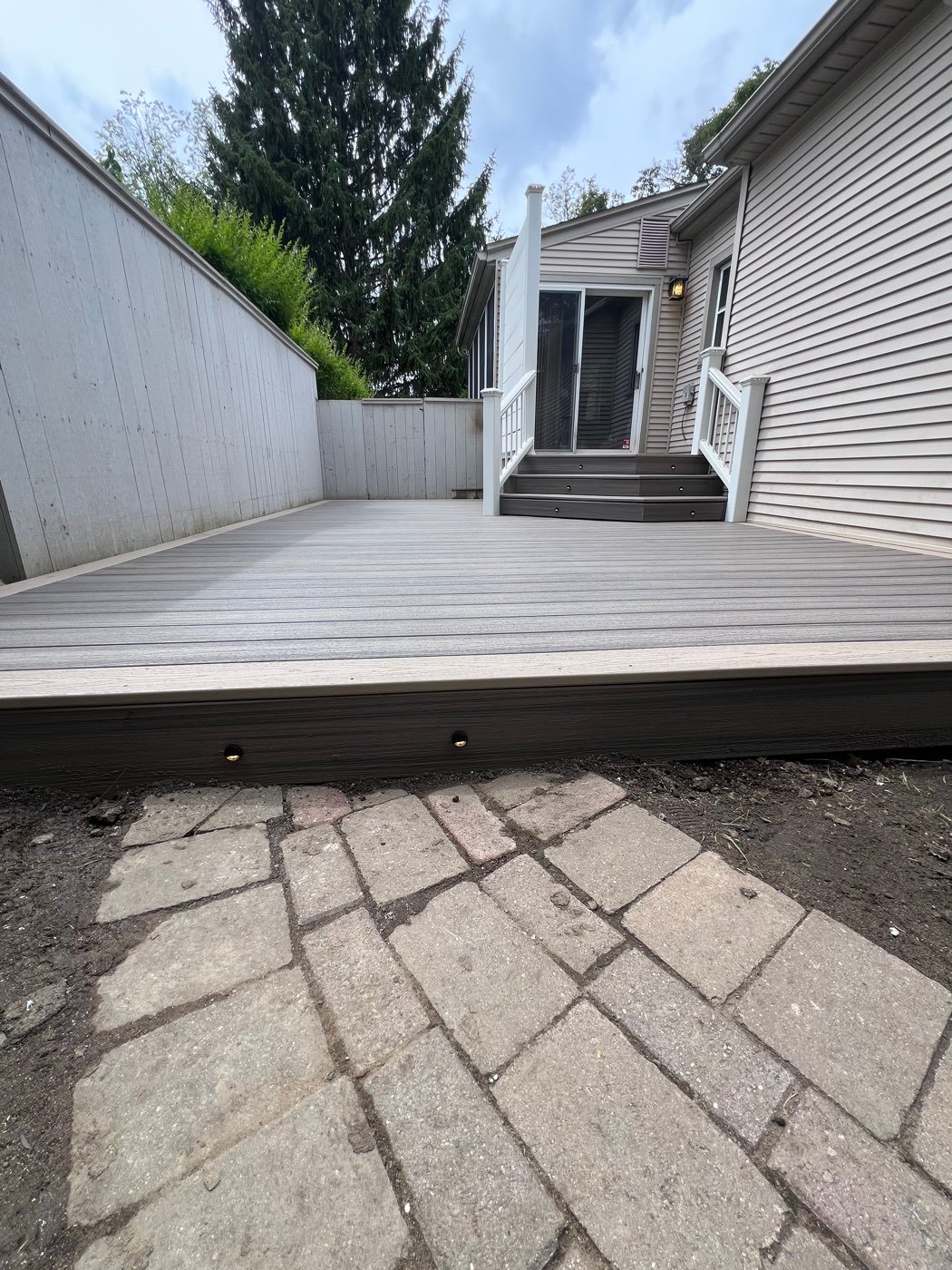 Deck lights built into the fascia of a composite deck