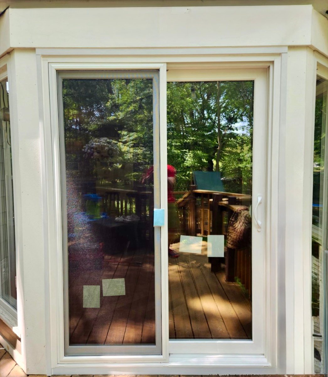 New white sliding patio door installed by MBG Exteriors & More