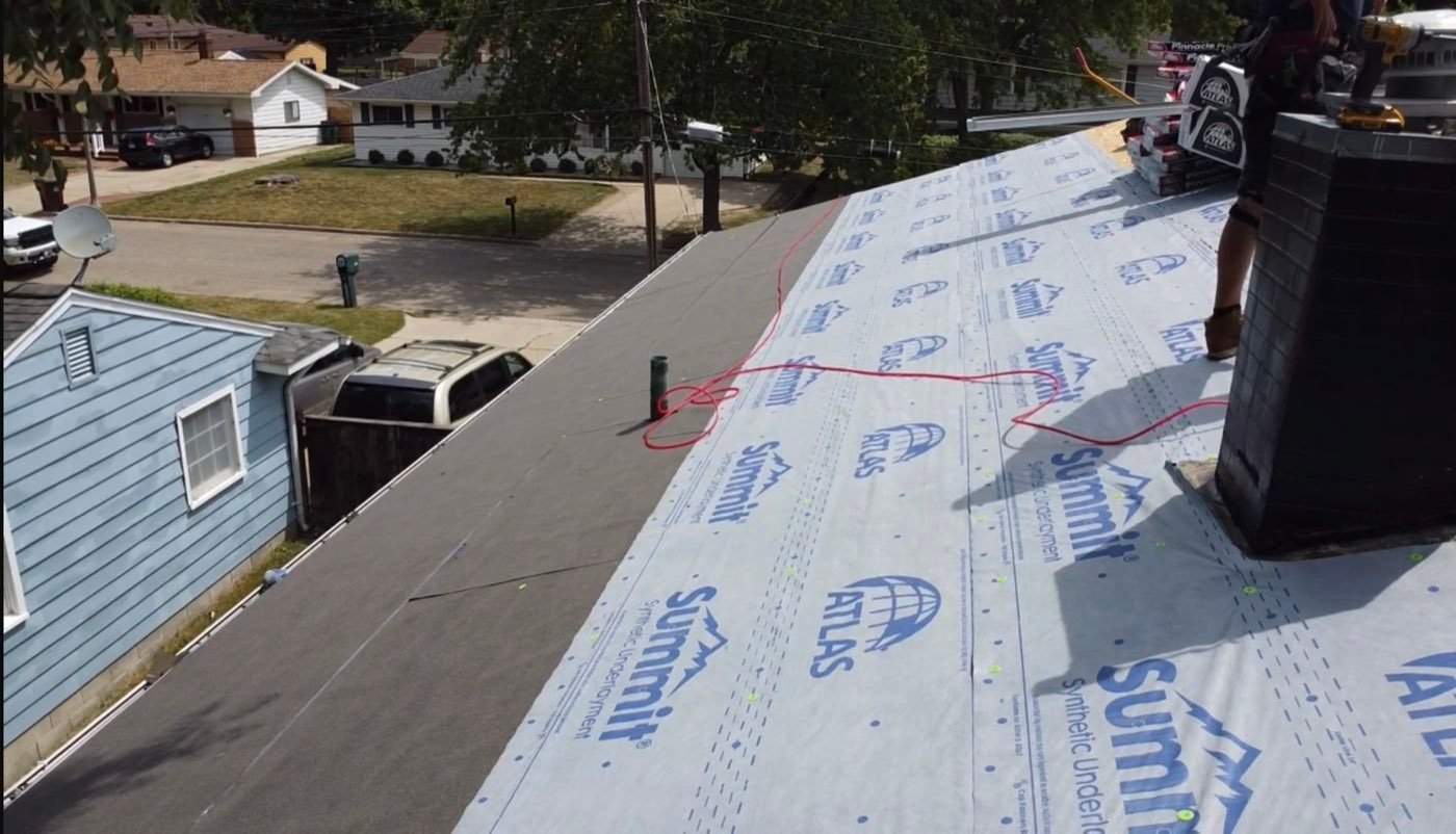Synthetic underlayment going down during a roof replacement